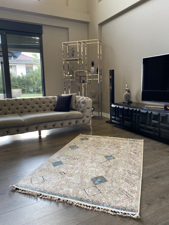 This vibrant digital printed rug features a bold pattern with pops of color, finished off with colorful fringes or braided fringes