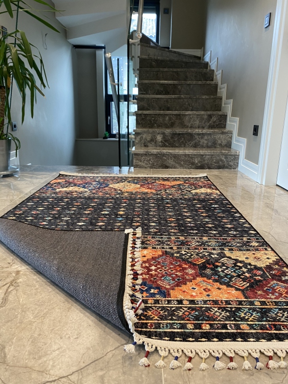 This vibrant digital printed rug features a bold pattern with pops of color, finished off with colorful fringes or braided fringes