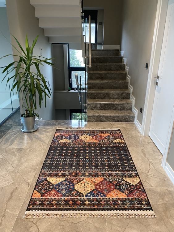 This vibrant digital printed rug features a bold pattern with pops of color, finished off with colorful fringes or braided fringes