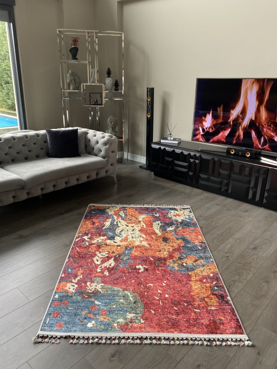 This vibrant digital printed rug features a bold pattern with pops of color, finished off with colorful fringes or braided fringes