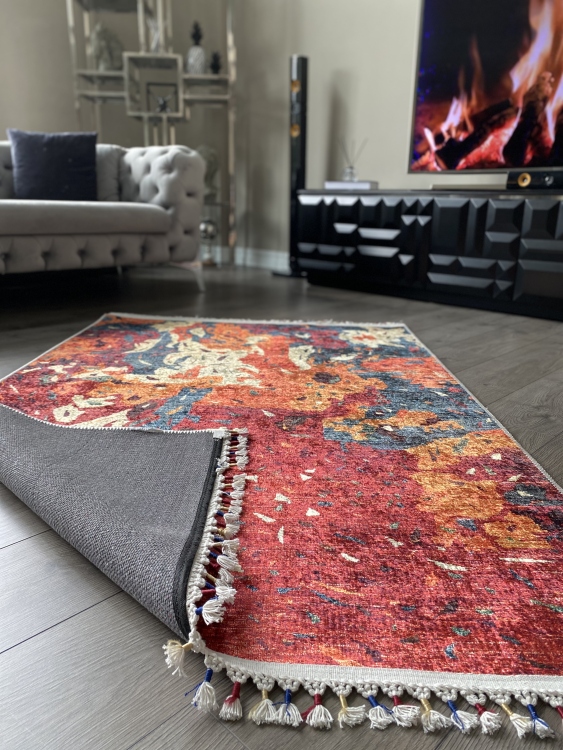 This vibrant digital printed rug features a bold pattern with pops of color, finished off with colorful fringes or braided fringes
