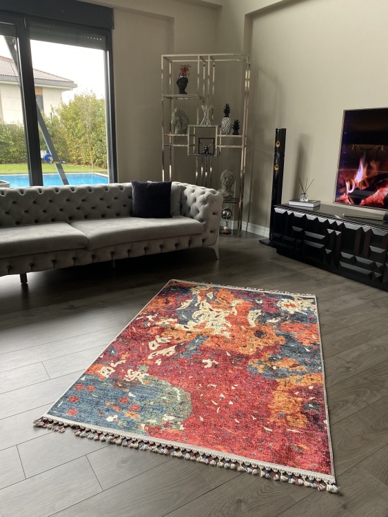 This vibrant digital printed rug features a bold pattern with pops of color, finished off with colorful fringes or braided fringes