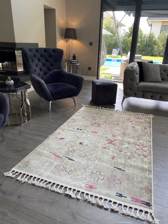 This vibrant digital printed rug features a bold pattern with pops of color, finished off with colorful fringes or braided fringes