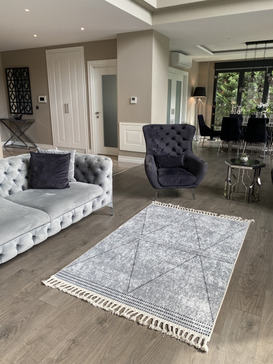 This vibrant digital printed rug features a bold pattern with pops of color, finished off with colorful fringes or braided fringes