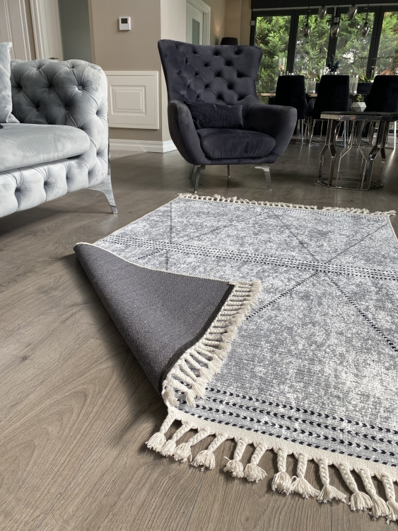 This vibrant digital printed rug features a bold pattern with pops of color, finished off with colorful fringes or braided fringes