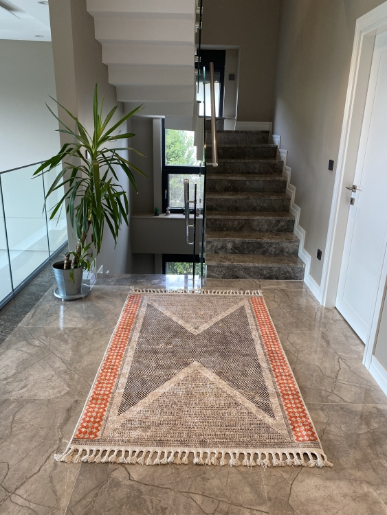 This vibrant digital printed rug features a bold pattern with pops of color, finished off with colorful fringes or braided fringes