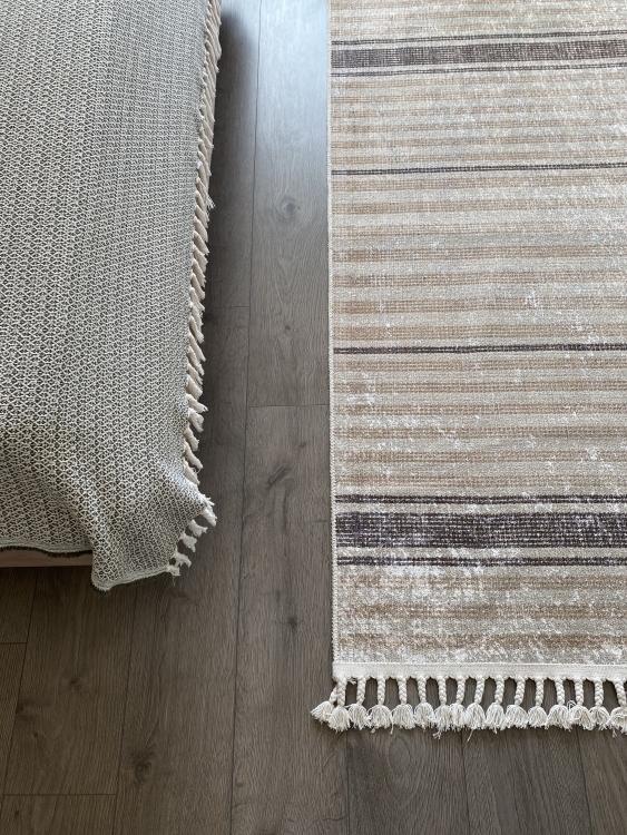 This vibrant digital printed rug features a bold pattern with pops of color, finished off with colorful fringes or braided fringes