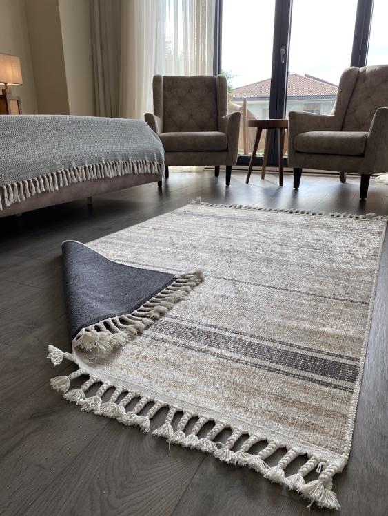 This vibrant digital printed rug features a bold pattern with pops of color, finished off with colorful fringes or braided fringes