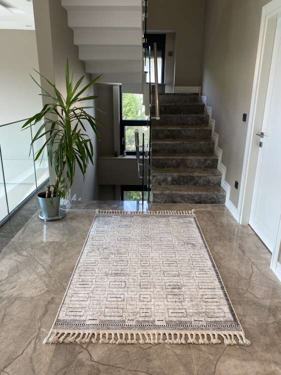 This vibrant digital printed rug features a bold pattern with pops of color, finished off with colorful fringes or braided fringes