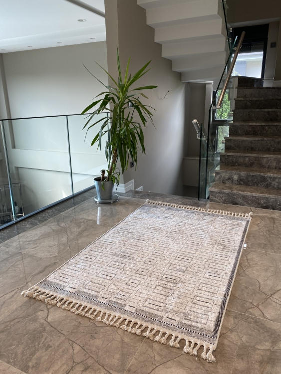 This vibrant digital printed rug features a bold pattern with pops of color, finished off with colorful fringes or braided fringes