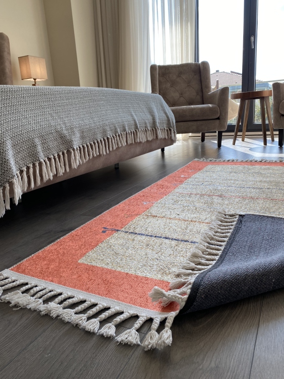 This vibrant digital printed rug features a bold pattern with pops of color, finished off with colorful fringes or braided fringes