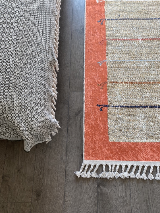 This vibrant digital printed rug features a bold pattern with pops of color, finished off with colorful fringes or braided fringes