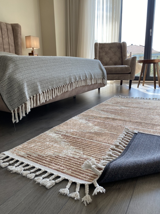 This vibrant digital printed rug features a bold pattern with pops of color, finished off with colorful fringes or braided fringes