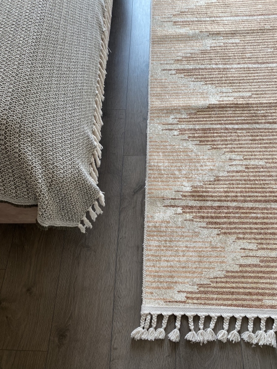 This vibrant digital printed rug features a bold pattern with pops of color, finished off with colorful fringes or braided fringes