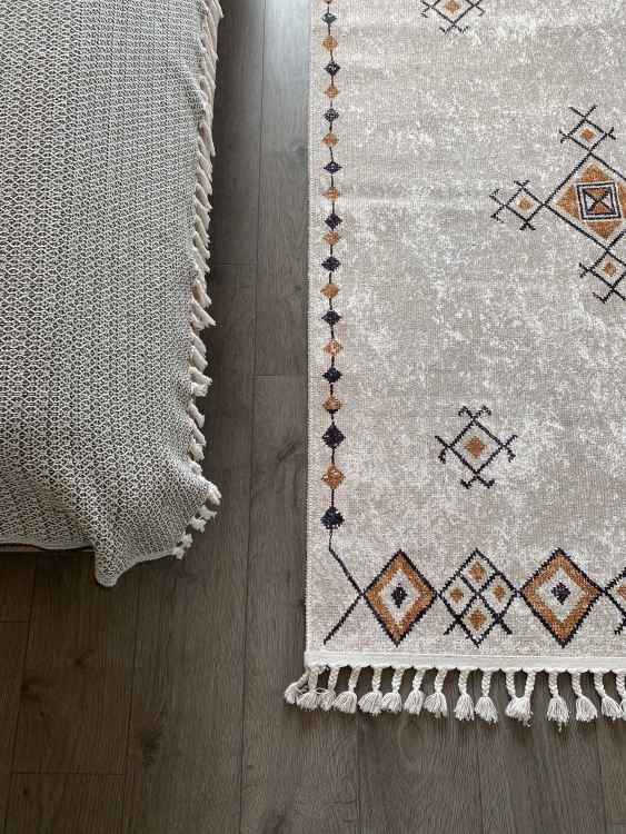 This vibrant digital printed rug features a bold pattern with pops of color, finished off with colorful fringes or braided fringes