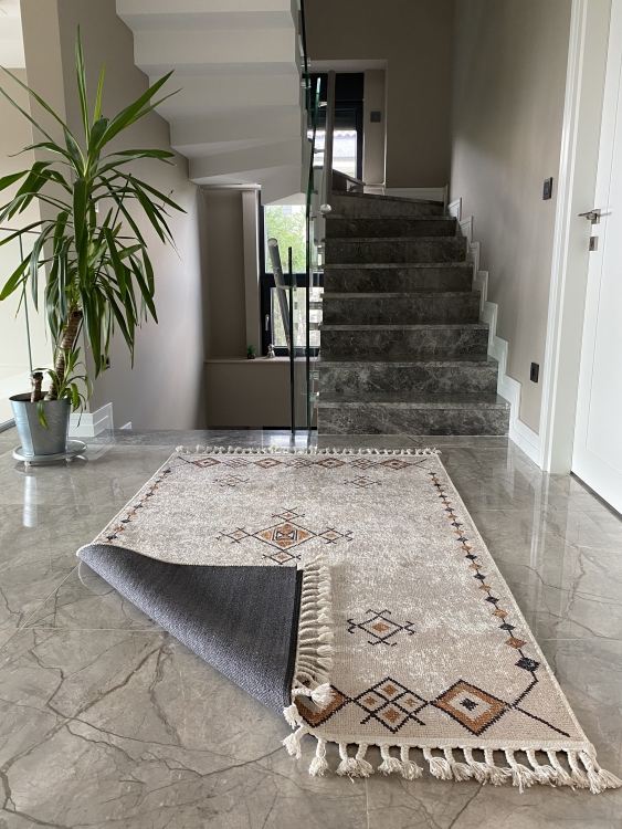 This vibrant digital printed rug features a bold pattern with pops of color, finished off with colorful fringes or braided fringes