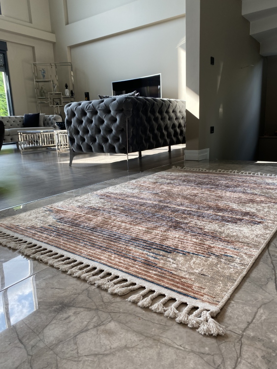 This vibrant digital printed rug features a bold pattern with pops of color, finished off with colorful fringes or braided fringes