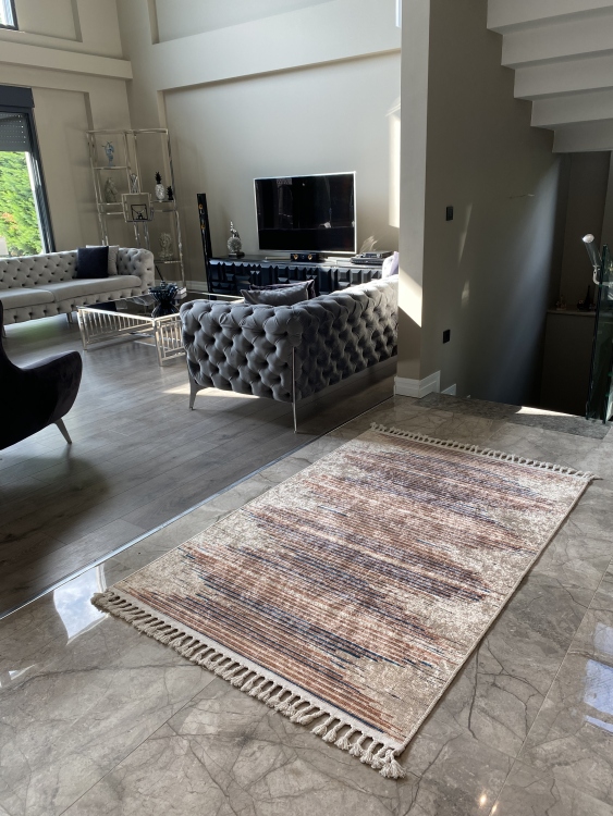 This vibrant digital printed rug features a bold pattern with pops of color, finished off with colorful fringes or braided fringes