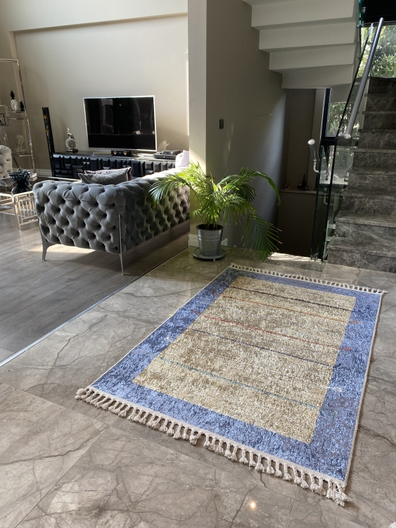 This vibrant digital printed rug features a bold pattern with pops of color, finished off with colorful fringes or braided fringes