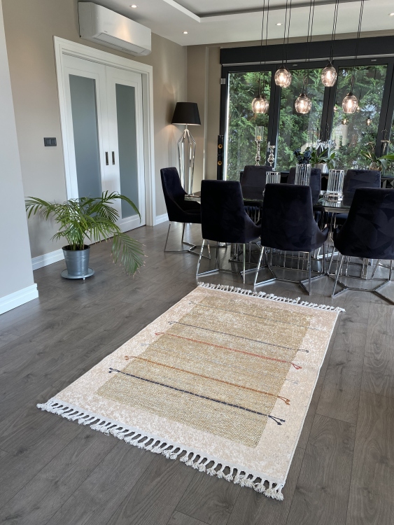 This vibrant digital printed rug features a bold pattern with pops of color, finished off with colorful fringes or braided fringes