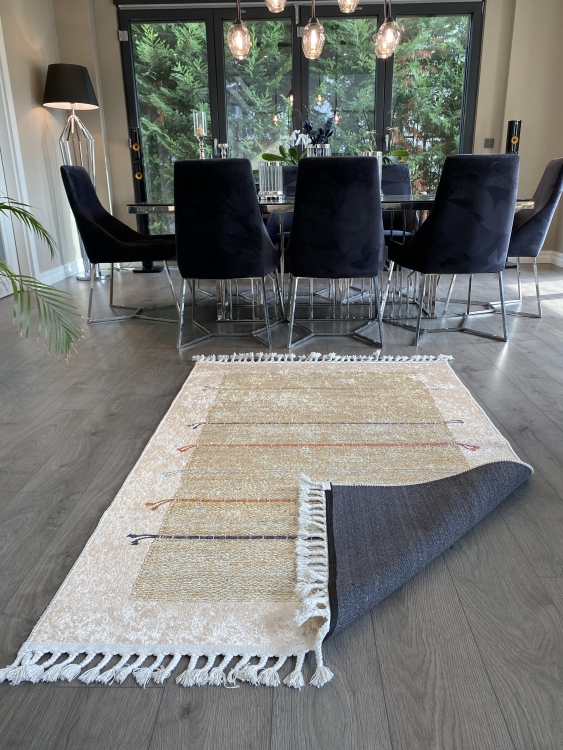 This vibrant digital printed rug features a bold pattern with pops of color, finished off with colorful fringes or braided fringes