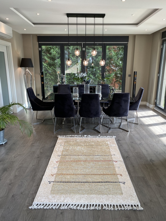 This vibrant digital printed rug features a bold pattern with pops of color, finished off with colorful fringes or braided fringes