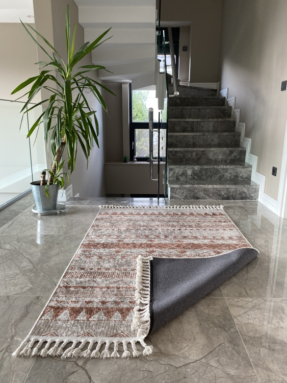 This vibrant digital printed rug features a bold pattern with pops of color, finished off with colorful fringes or braided fringes