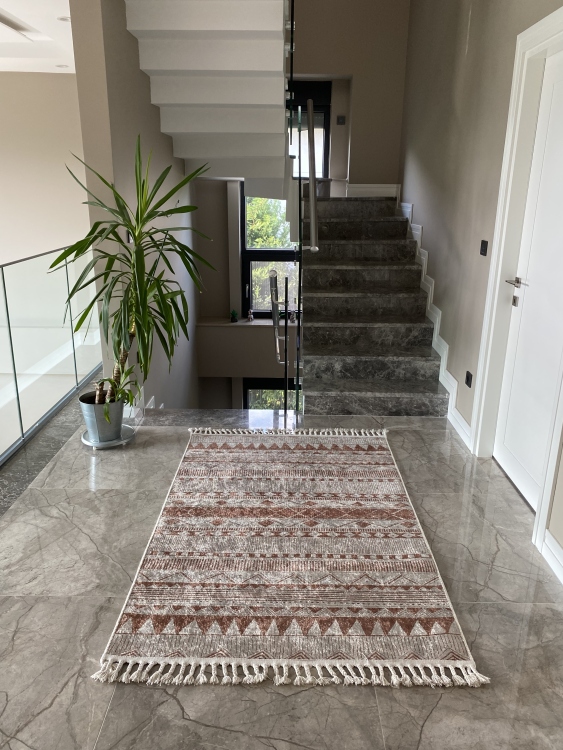 This vibrant digital printed rug features a bold pattern with pops of color, finished off with colorful fringes or braided fringes