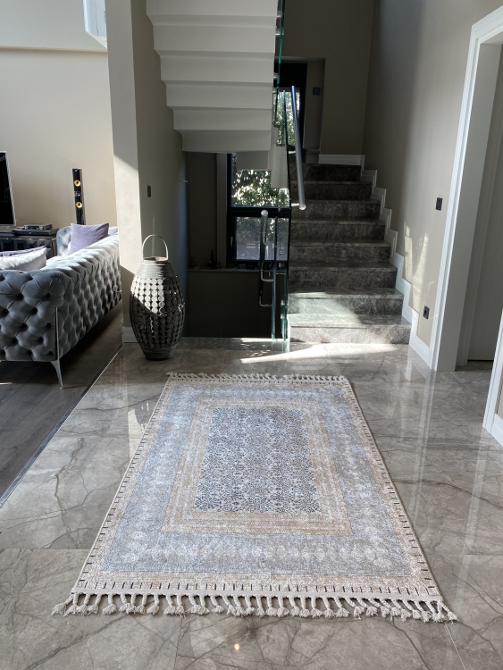 This vibrant digital printed rug features a bold pattern with pops of color, finished off with colorful fringes or braided fringes
