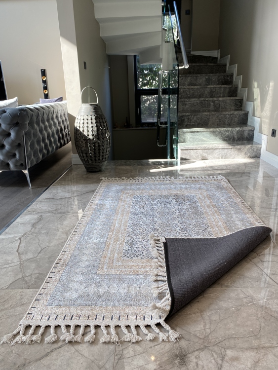 This vibrant digital printed rug features a bold pattern with pops of color, finished off with colorful fringes or braided fringes