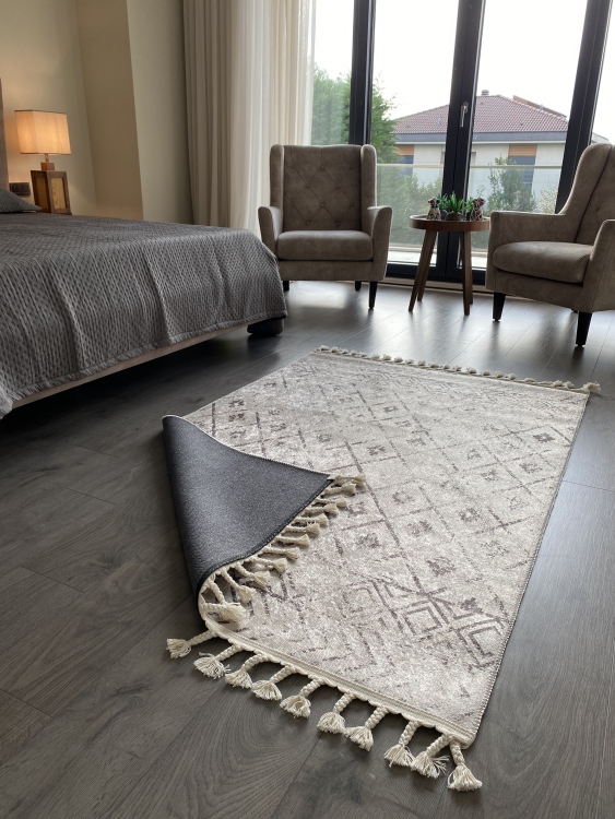 This vibrant digital printed rug features a bold pattern with pops of color, finished off with colorful fringes or braided fringes