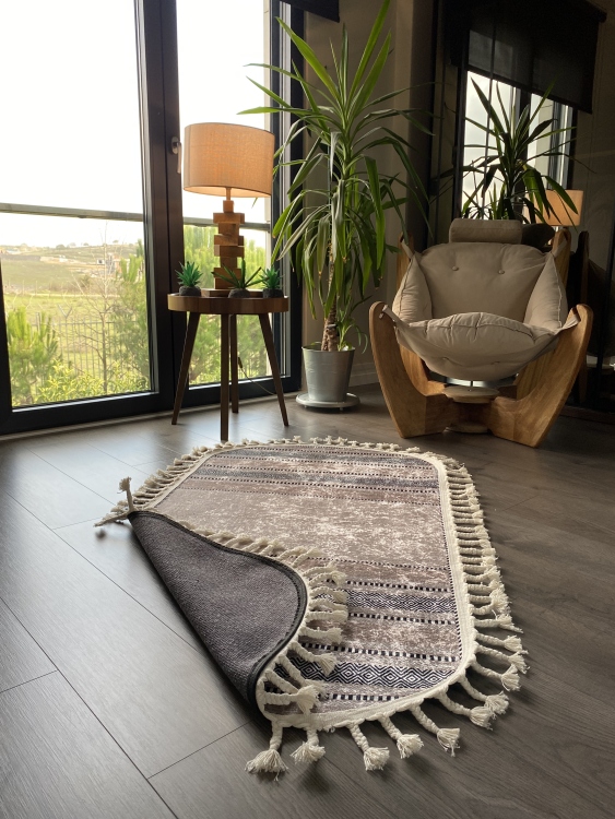 This vibrant digital printed rug features a bold pattern with pops of color, finished off with colorful fringes or braided fringes