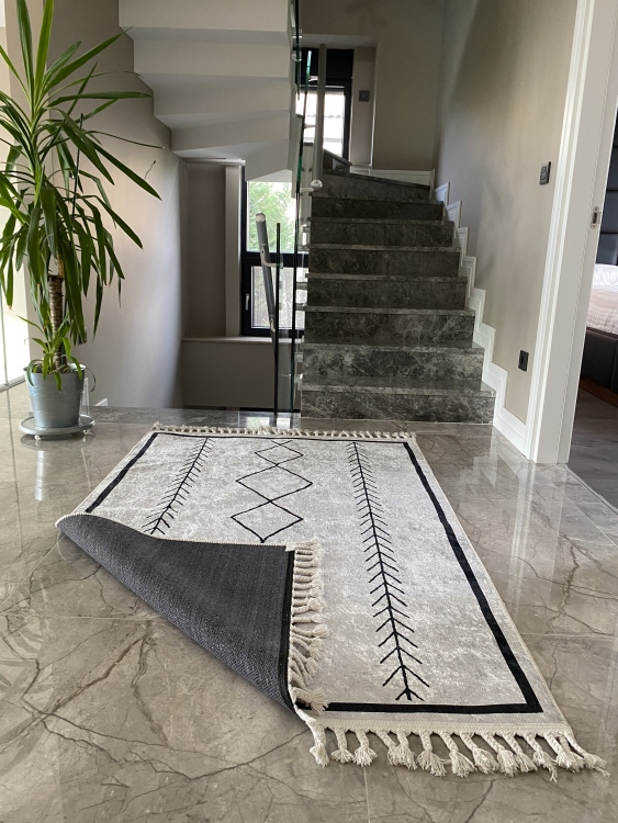 This vibrant digital printed rug features a bold pattern with pops of color, finished off with colorful fringes or braided fringes
