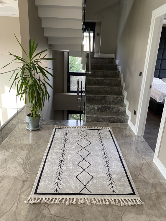 This vibrant digital printed rug features a bold pattern with pops of color, finished off with colorful fringes or braided fringes