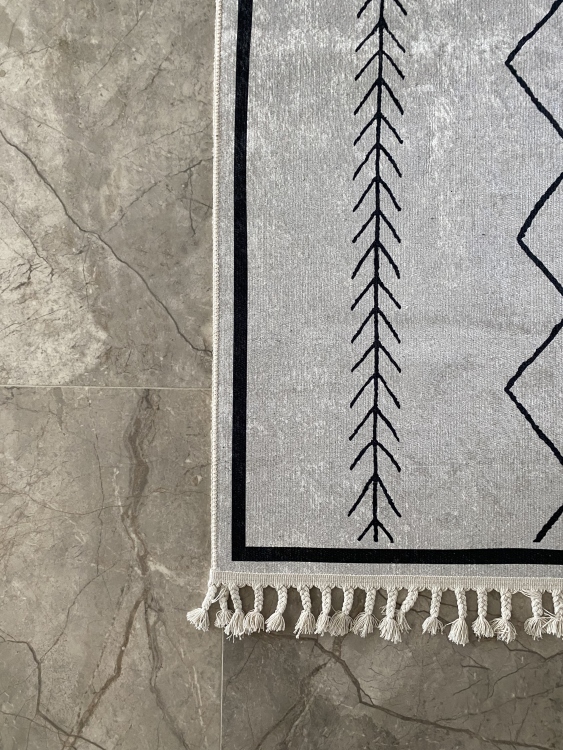 This vibrant digital printed rug features a bold pattern with pops of color, finished off with colorful fringes or braided fringes