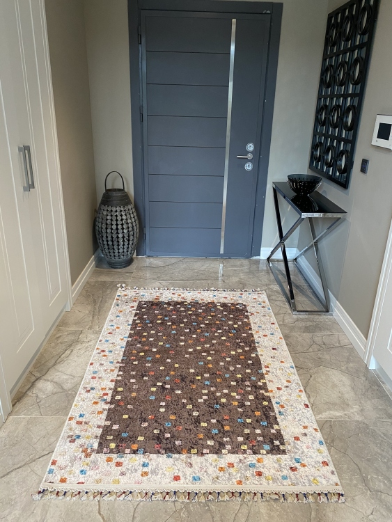This vibrant digital printed rug features a bold pattern with pops of color, finished off with colorful fringes or braided fringes