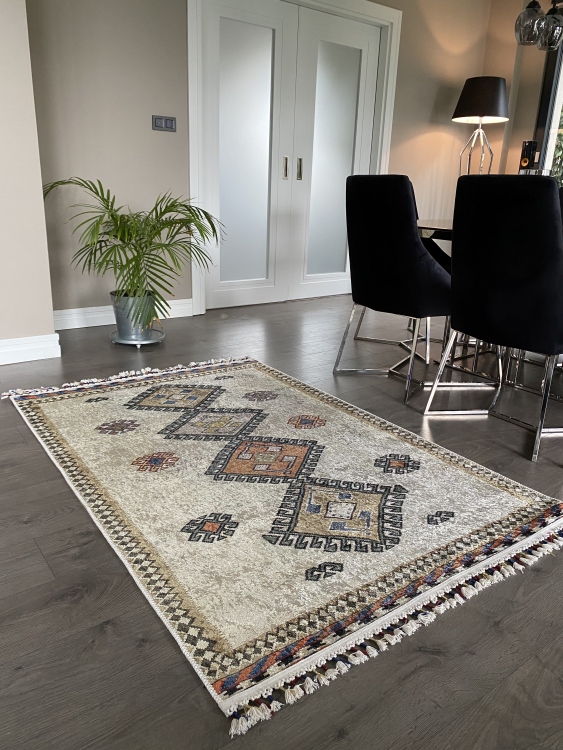 This vibrant digital printed rug features a bold pattern with pops of color, finished off with colorful fringes or braided fringes