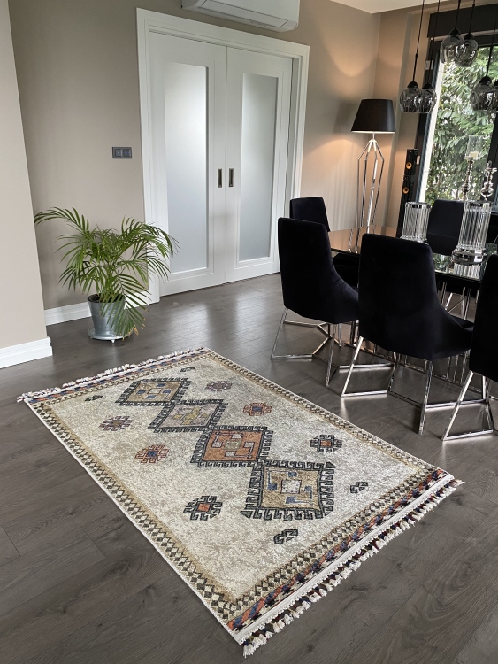This vibrant digital printed rug features a bold pattern with pops of color, finished off with colorful fringes or braided fringes