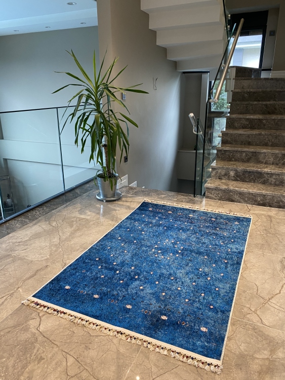 This vibrant digital printed rug features a bold pattern with pops of color, finished off with colorful fringes or braided fringes