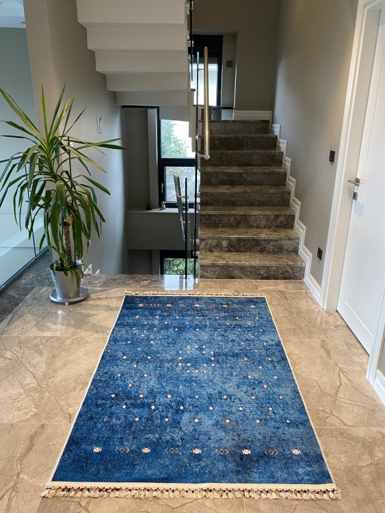 This vibrant digital printed rug features a bold pattern with pops of color, finished off with colorful fringes or braided fringes
