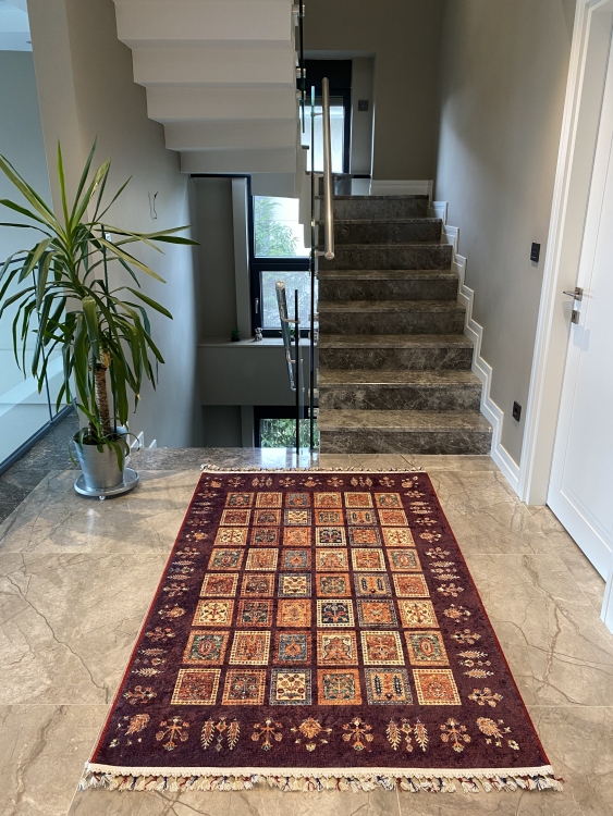 This vibrant digital printed rug features a bold pattern with pops of color, finished off with colorful fringes or braided fringes
