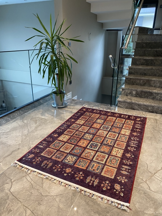 This vibrant digital printed rug features a bold pattern with pops of color, finished off with colorful fringes or braided fringes