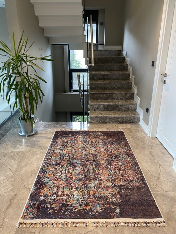 This vibrant digital printed rug features a bold pattern with pops of color, finished off with colorful fringes or braided fringes