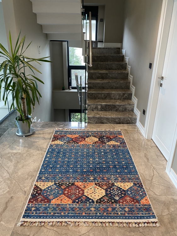 This vibrant digital printed rug features a bold pattern with pops of color, finished off with colorful fringes or braided fringes