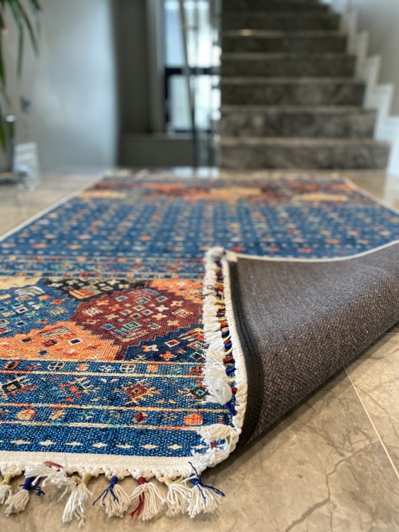 This vibrant digital printed rug features a bold pattern with pops of color, finished off with colorful fringes or braided fringes
