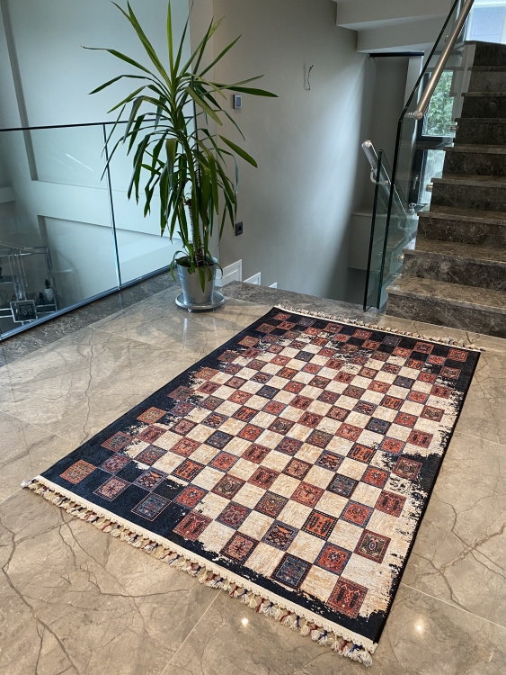This vibrant digital printed rug features a bold pattern with pops of color, finished off with colorful fringes or braided fringes
