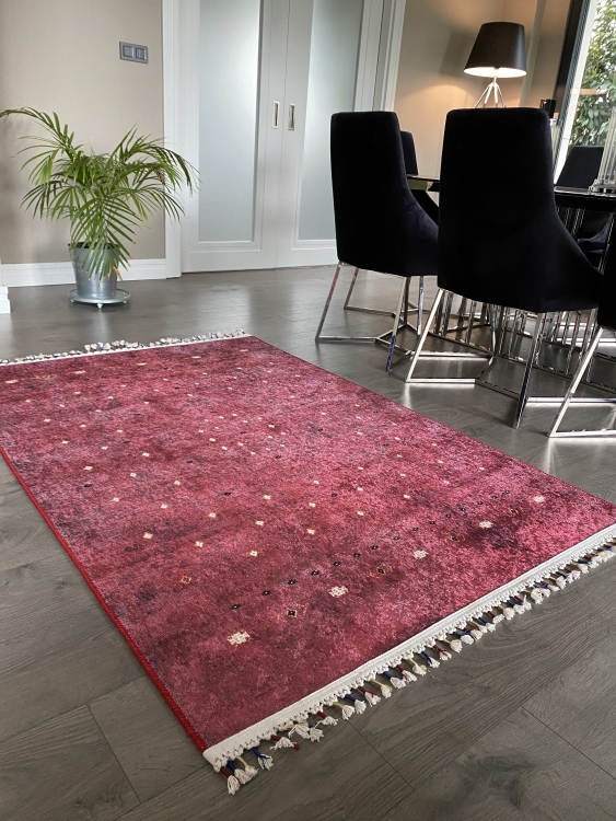 This vibrant digital printed rug features a bold pattern with pops of color, finished off with colorful fringes or braided fringes