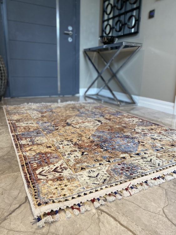 This vibrant digital printed rug features a bold pattern with pops of color, finished off with colorful fringes or braided fringes