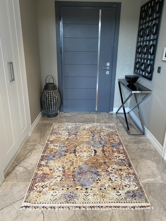 This vibrant digital printed rug features a bold pattern with pops of color, finished off with colorful fringes or braided fringes