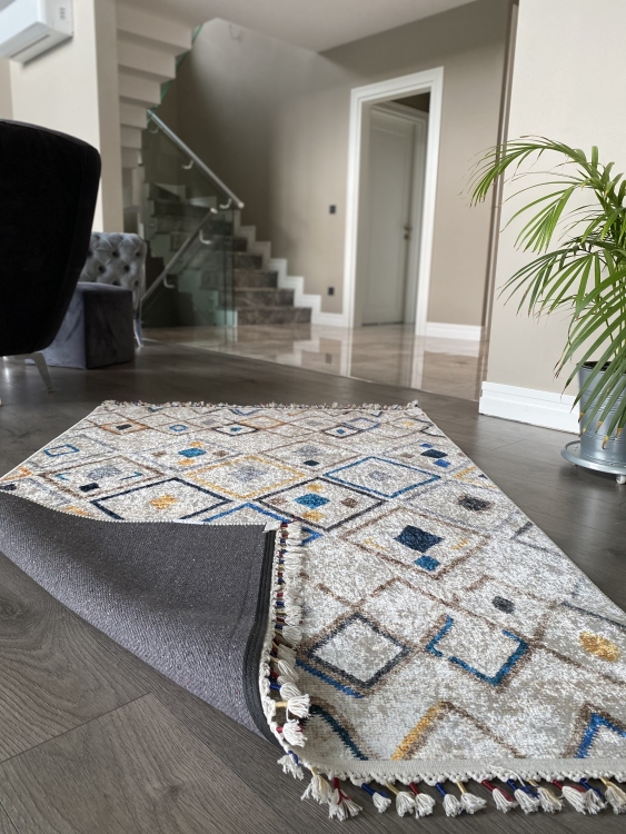 This vibrant digital printed rug features a bold pattern with pops of color, finished off with colorful fringes or braided fringes
